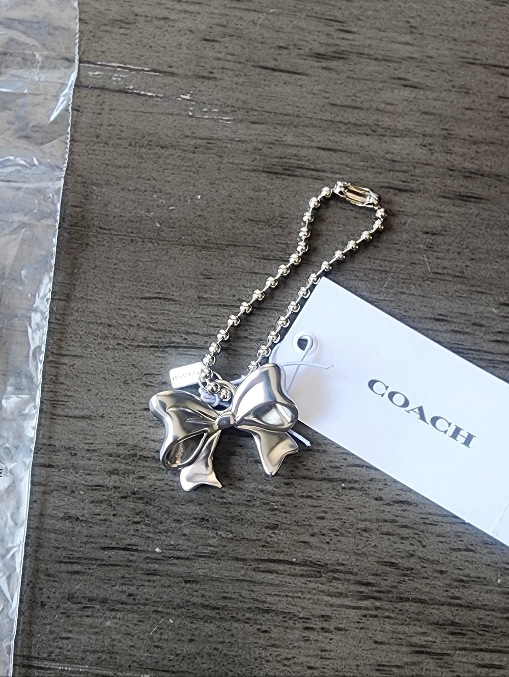NWT Coach New York Exclusive Silver Bow Charm With Chain